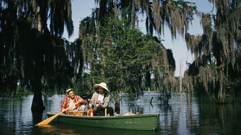 A couple picnics in a canoe in Chicot State Park, which is Louisiana's largest state park at 6,400 acres. Getty Images