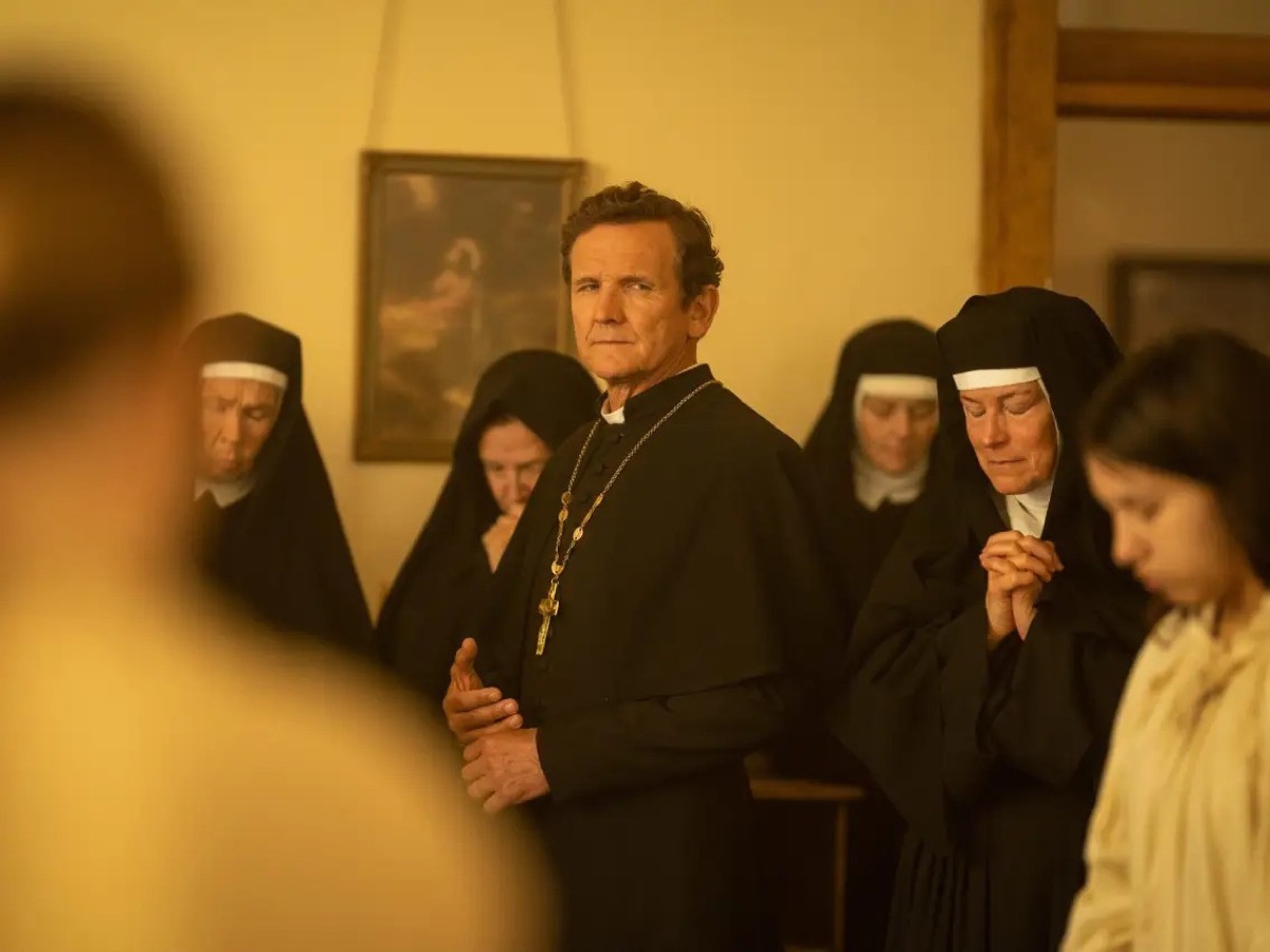 <p>Father Renaud is played by <strong>Sebastian Roché</strong>, of <em>Vampire Diaries </em>and <em>Supernatural </em>fame. Renaud is the sadistic French Roman Catholic priest who's headmaster of Teonna's boarding school.<p><strong>RELATED: <a rel="noopener noreferrer external nofollow" href="https://bestlifeonline.com/tv-shows-not-streaming-news/">6 Beloved TV Shows You Can't Stream Anywhere</a>.</strong></p></p>