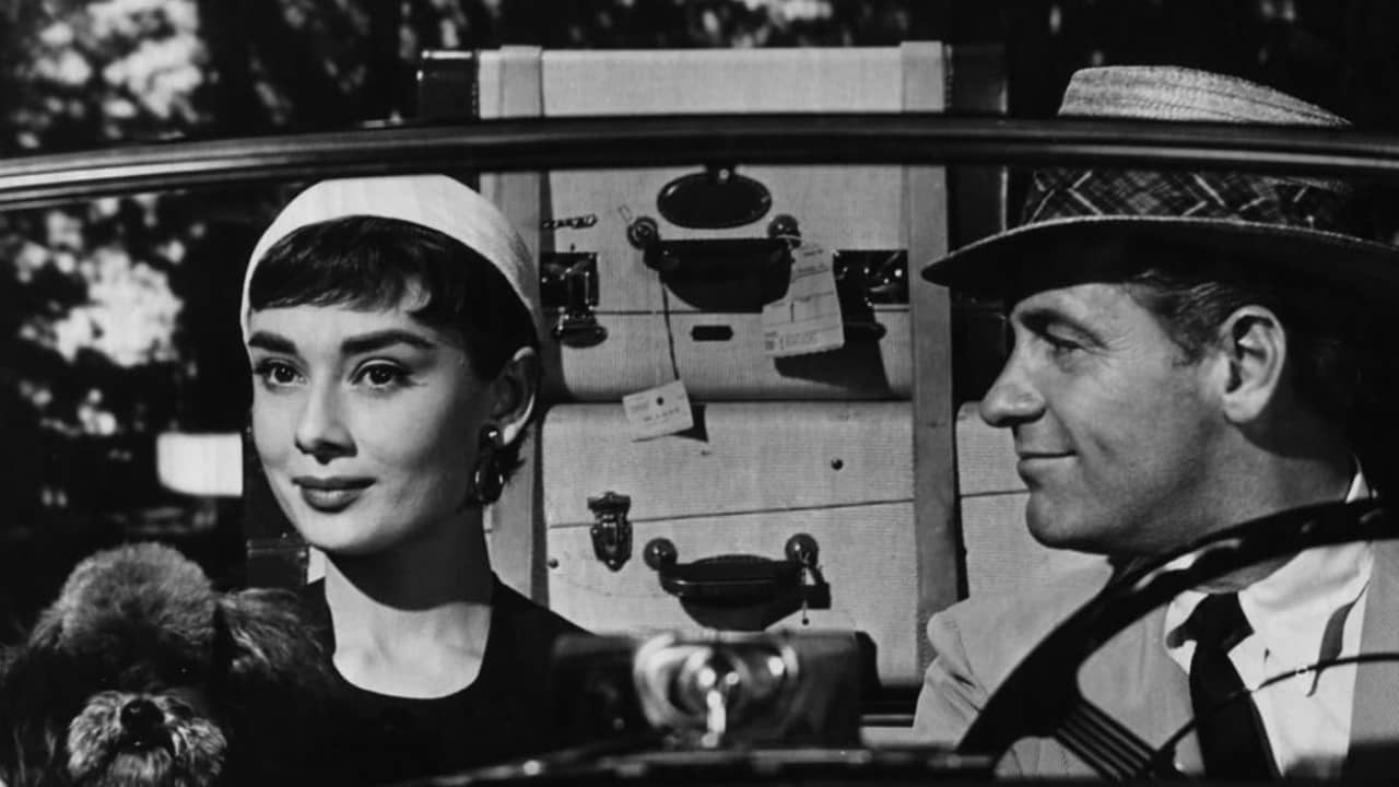 <p>The director returned to the romantic comedy with <em>Sabrina,</em> a modern fairytale starring <a href="https://en.wikipedia.org/wiki/Audrey_Hepburn" rel="nofollow noopener">Audrey Hepburn</a>, Humphrey Bogart, and (once again) William Holden. Hepburn plays the title character, the charming daughter of the chauffeur for the wealthy Larrabee family, who catches the eye of the family’s aristocratic charmer, David Larrabee. When this pairing could derail a profitable corporate merger, the older brother Linus steps in to woo Sabrina himself, falling in love with her in the process.</p><p>One senses that Wilder crafted this champagne-like confection to take a break from his previous films’ bleak, cynical tone. While the film mainly works due to Hepburn’s romantic charisma, the age disparity (30 years!) between her and Bogart will be hard for modern audiences to accept. Also problematic is that Hepburn shares fantastic chemistry with her other co-star, Holden, warping the romantic triangle. In fact, Holden seems to be having the time of his life by playing the superficial aristocrat, which makes him a far more interesting character to watch.</p><p>In 1995 <em>Sabrina </em>received a well-regarded remake with Harrison Ford and Julia Ormond in the lead roles. This version does a better job of ironing out the relationship’s May-December nature, featuring Ford in his handsome, comedic prime as the older brother Linus.</p>