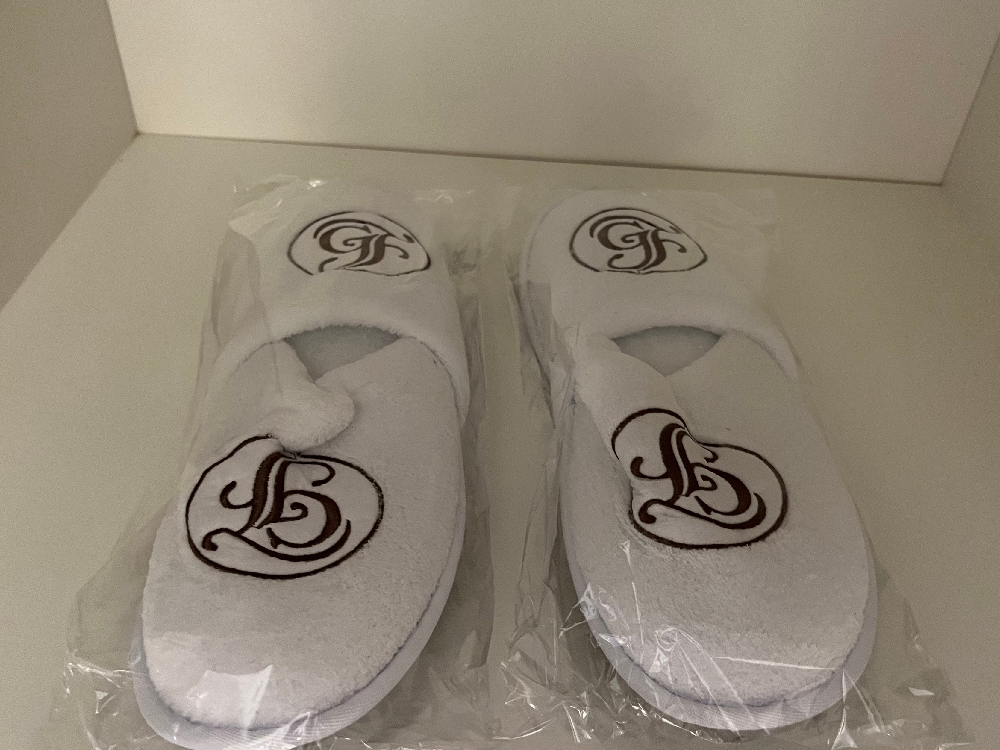 <p>This is the only Disney World hotel I've stayed at where I've seen complimentary slippers.</p><p>Although they were just lightweight spa slippers, they were comfortable to wear when walking around the room and after taking a shower. </p><p>I decided not to try on the matching robe, but it was super beautiful to look at.</p>