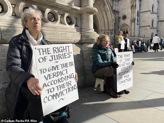 protester committed contempt of court using a sign