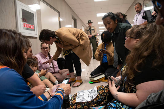 Protesters along with Rep. Justin Jones, D- Nashville sit outside the hallway where Allison Polidor is being detained during a House session at Tennessee Capitol in Nashville , Tenn., Thursday, April 18, 2024. Nicole Hester / The Tennessean / USA TODAY NETWORK