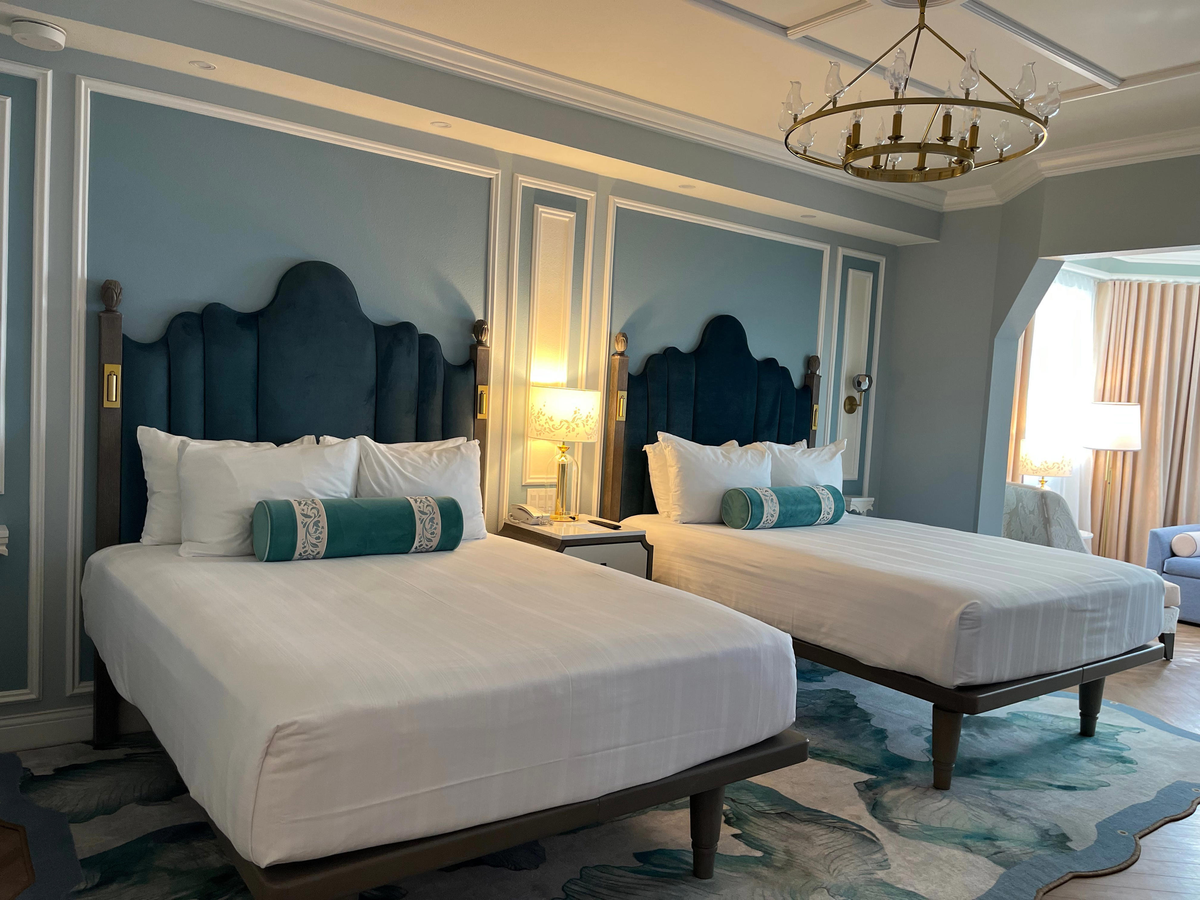 <p>For a standard room with two queen-sized beds, I couldn't believe how spacious it was.</p><p>It had two televisions which I'd never seen in a <a href="https://www.businessinsider.com/is-yacht-club-resort-worth-it-for-families-disney-world-review-2021">standard-size room at Disney</a> before.</p><p>Although it was just me and my sister staying in the room, I'd say it was large enough to comfortably fit at least four people.</p>