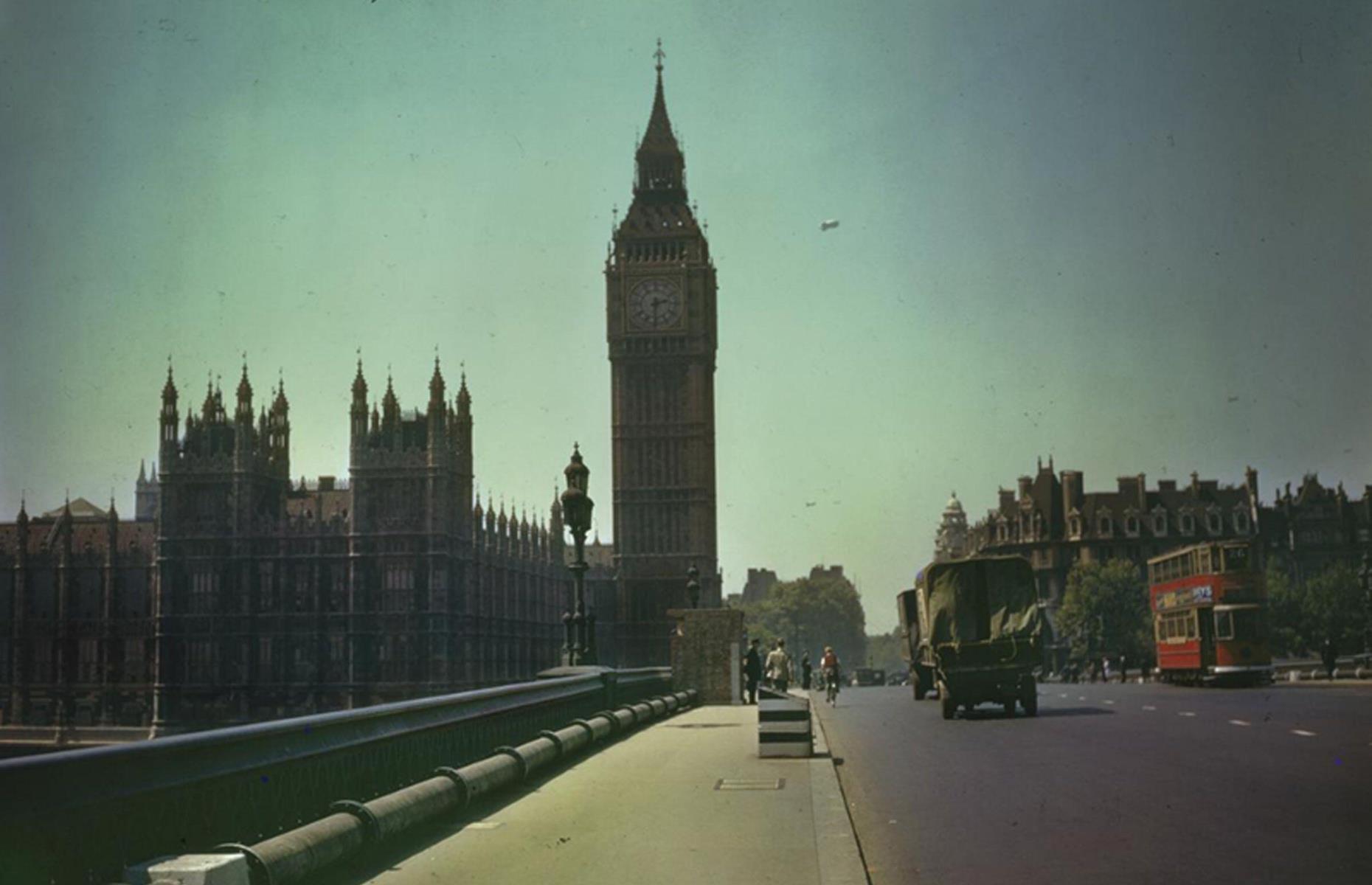 <p>Snapped during the Second World War, this picture shows the iconic Big Ben clock tower and adjoining Houses of Parliament seen from Westminster Bridge, with military vehicles and a vintage tram crossing the river and military barrage balloons in the sky in the background.  Construction of the clock tower began in 1843 and today the building stands at 315 feet (96m) tall.</p>  <p>While it would have been virtually deserted during the war, today one of London’s greatest landmarks receives around 4.5 million visitors per year.</p>