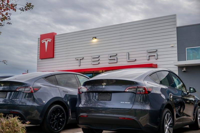 tesla stock hit its lowest point in a year after analysts said investors may start 'tossing in the towel'