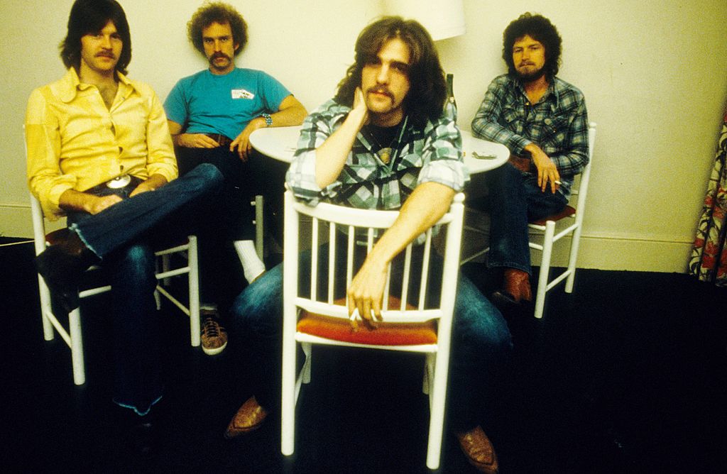 <p>Performing in 1971, the group still didn't have an official name and played under Teen King and the Emergencies for the first time in Aspen. Supposedly, the name the "Eagles" was conceived during a peyote and tequila filled group out in the Mojave Desert. </p> <p>Another account suggests that the group came up with the name when Glenn Fry shouted, "Eagles!" when he saw them flying above. In actor/musicians Steve Martin's autobiography, he recalls suggesting that they call the band "the Eagles," but Glenn Frey was adamant that the group was just "Eagles." </p>