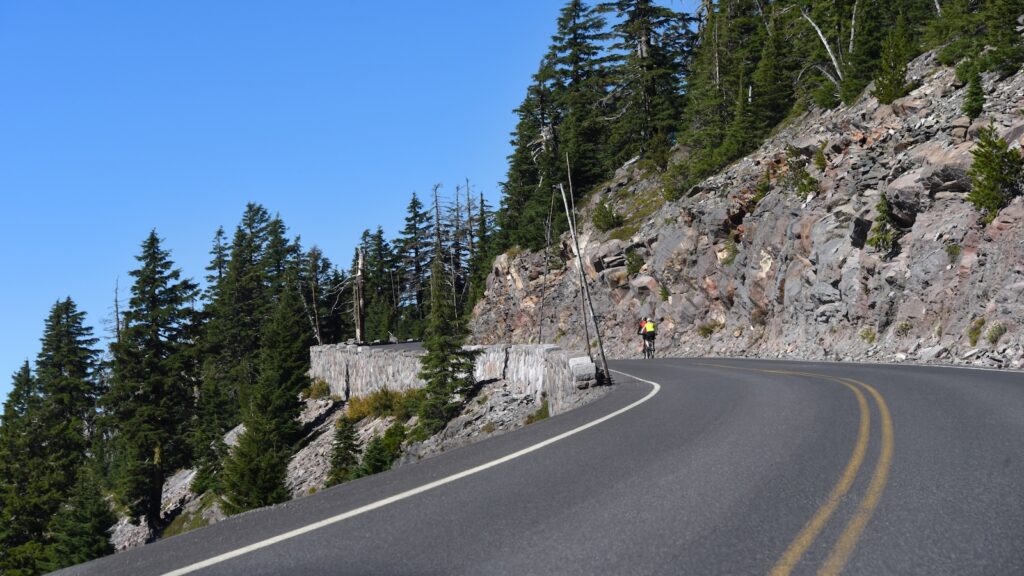 <p>During the late summer, a large portion of the road around the Crater Lake rim is closed to vehicle traffic for the Ride the Rim bicycling event. These car-free days ensure bikers can enjoy the same views offered to motor vehicle traffic during the rest of this summer.</p><p>This demanding ride will test even the heartiest bikers with the road’s high base elevation, steep hills, and occasional rough weather.</p><p>If the full 33-mile loop is too much, there are also shorter options with shuttles to take you and your bike back to the start.</p>