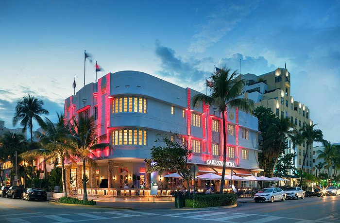 Originally built in 1939 as the Parisian Hotel, the Cardozo Hotel is another standout Art Deco gem on Ocean Drive. Renovated in the 1980s and renamed after actor and former owner Benjamin Cardozo, it features a striking blue facade and classic Art Deco details.]]>