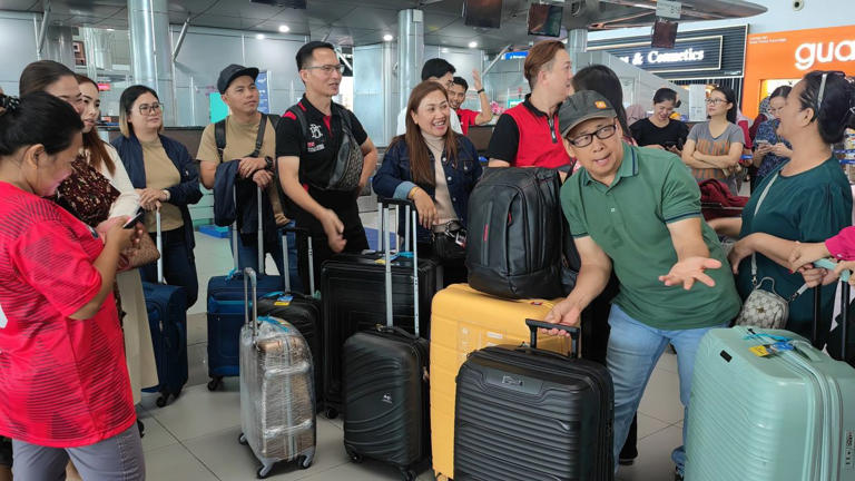 Couples Kuhim Ugat (second right) and Lamuin Salimun (right), and Kristany Ubud (third left) and Kadmil Gungat (second left) learned their flight to Kuala Lumpur were cancelled after arriving the Kota Kinabalu International Airport Friday morning (April 19).
