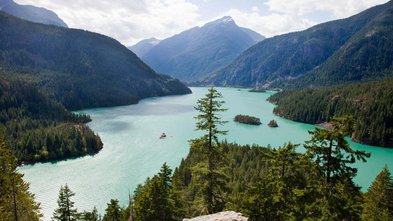 Diablo Lake is one element of Washington state's North Cascades National Park that draws tens of thousands of visitors each year. Park-goers can take canoes or kayaks out on the water to experience the lake's beauty up close. Getty Images