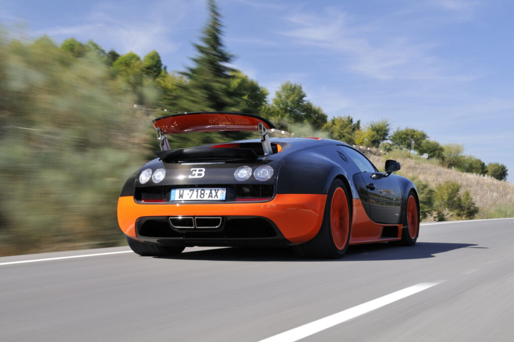 <p>Unveiled in 2010, the Veyron Super Sport was recognized by the Guinness World Records as the fastest street-legal production car in the world, with a top speed of 267.8 mph. It featured an 8.0-liter quad-turbocharged W16 engine that produced 1,200 horsepower and reached 0-60 mph in just 2.4 seconds.</p>