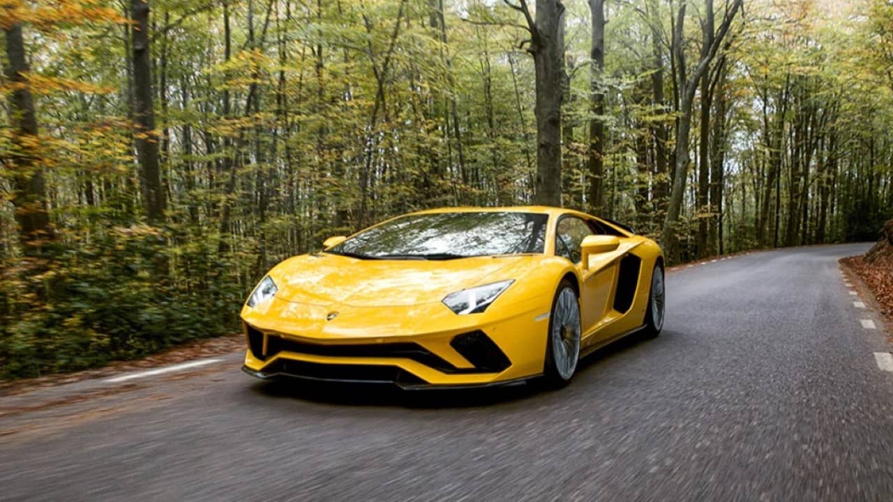 <p>The Lambo may be a cliche choice, but there is nothing cliche about the 2021 Lamborghini Aventador. If you want to embrace nostalgia while embodying the essence of classic supercars, this is your dream car. </p><p>Housing a roaring 730-plus-horsepower 6.5-liter V-12 engine, this Italian powerhouse, available in coupe and convertible forms, delivers an unforgettable experience. </p><p>Though the automated manual transmission can feel clunky in traffic, the Aventador’s athletic prowess shines through, especially with the track-tuned SVJ model that amps up the thrill. </p>
