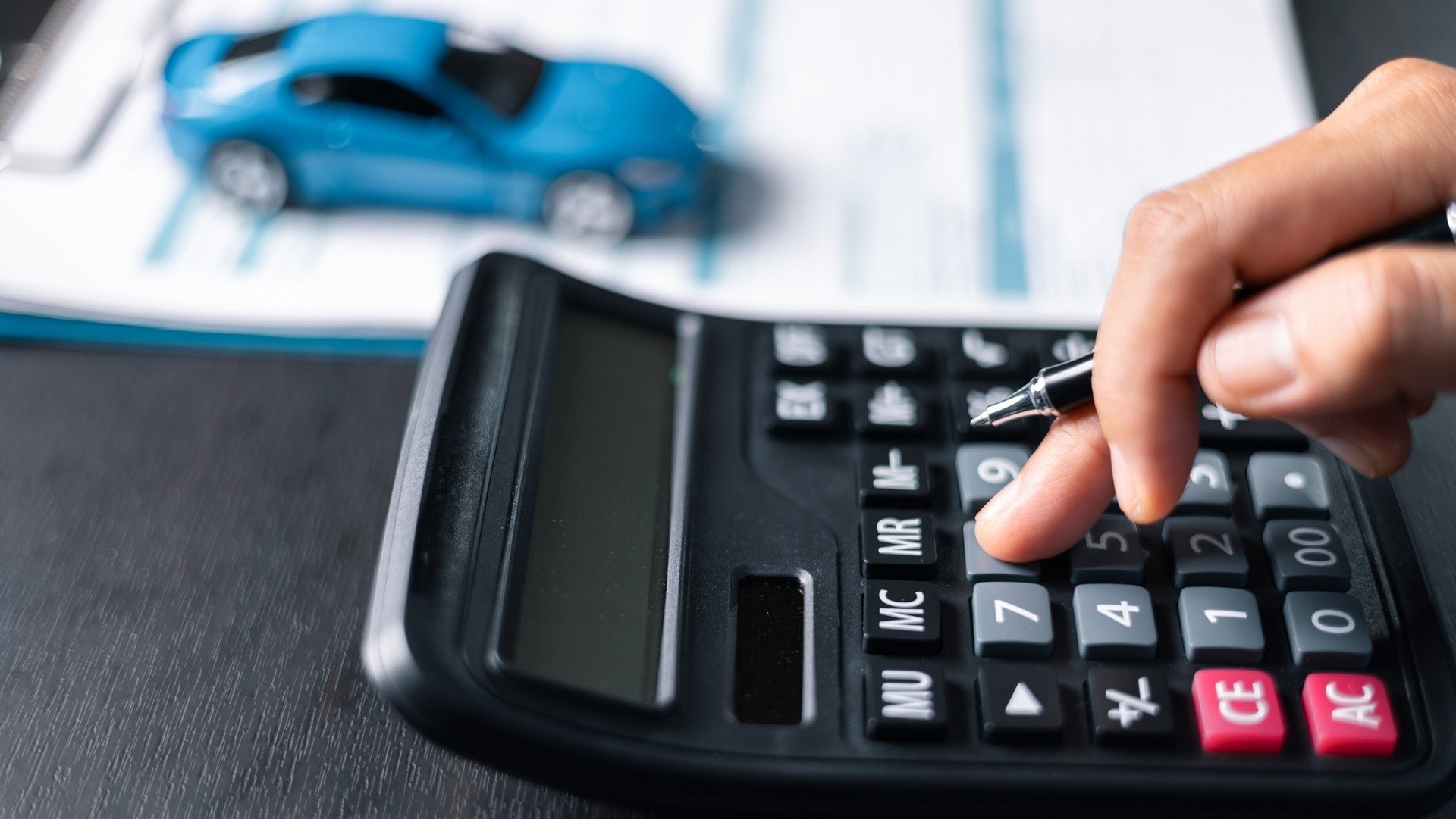 toy car calculator contract auto loan concept_iStock-1789263758