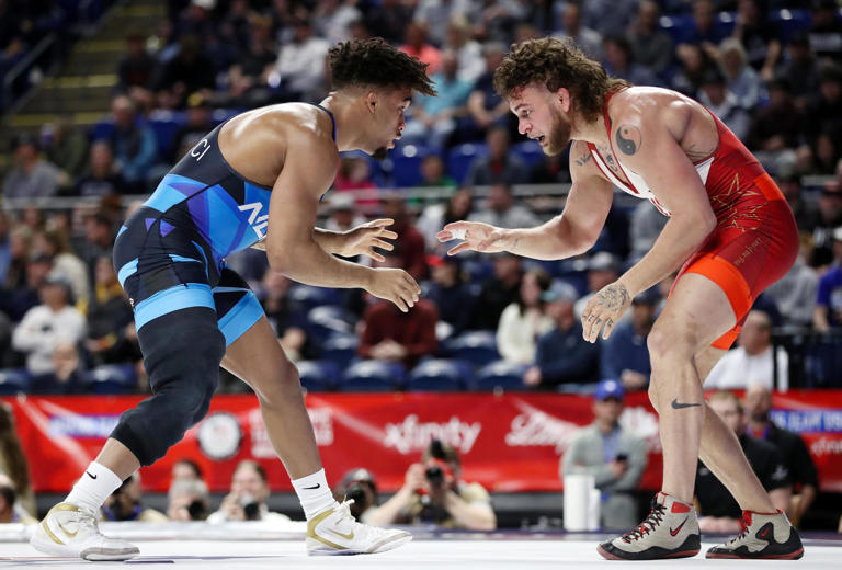 Apr 19, 2024; State College, Pennsylvania, USA; Penn State four-time NCAA champ Carter Starocci (left) wrestles Patrick Downey (right) in a 86 kilograms preliminary match during the U.S. Olympic Wrestling Team Trials at Bryce Jordan Center at Penn State University. Mandatory Credit: Matthew O'Haren-USA TODAY Sports