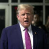 Former President Donald Trump speaks to reporters outside the courtroom Friday<br>