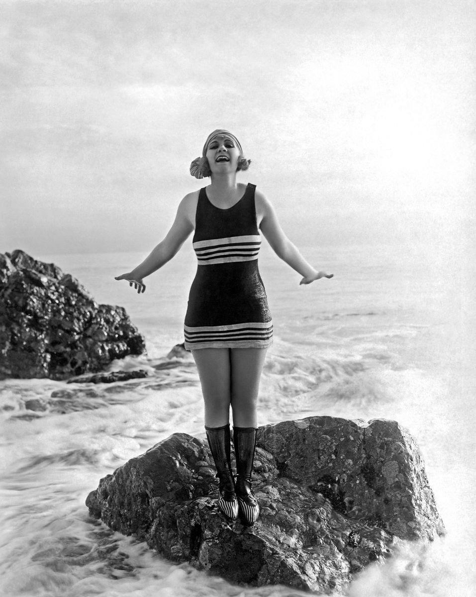 <p><a href="https://www.history.com/topics/roaring-twenties/flappers">Flappers</a>—independent and spirited young American women during the 1920s—embraced the fashions of the day, which were typically more revealing in terms of the legs, though straighter and less form-fitting. Flapper swimwear was knit and provided a more “relaxed silhouette.”</p>
