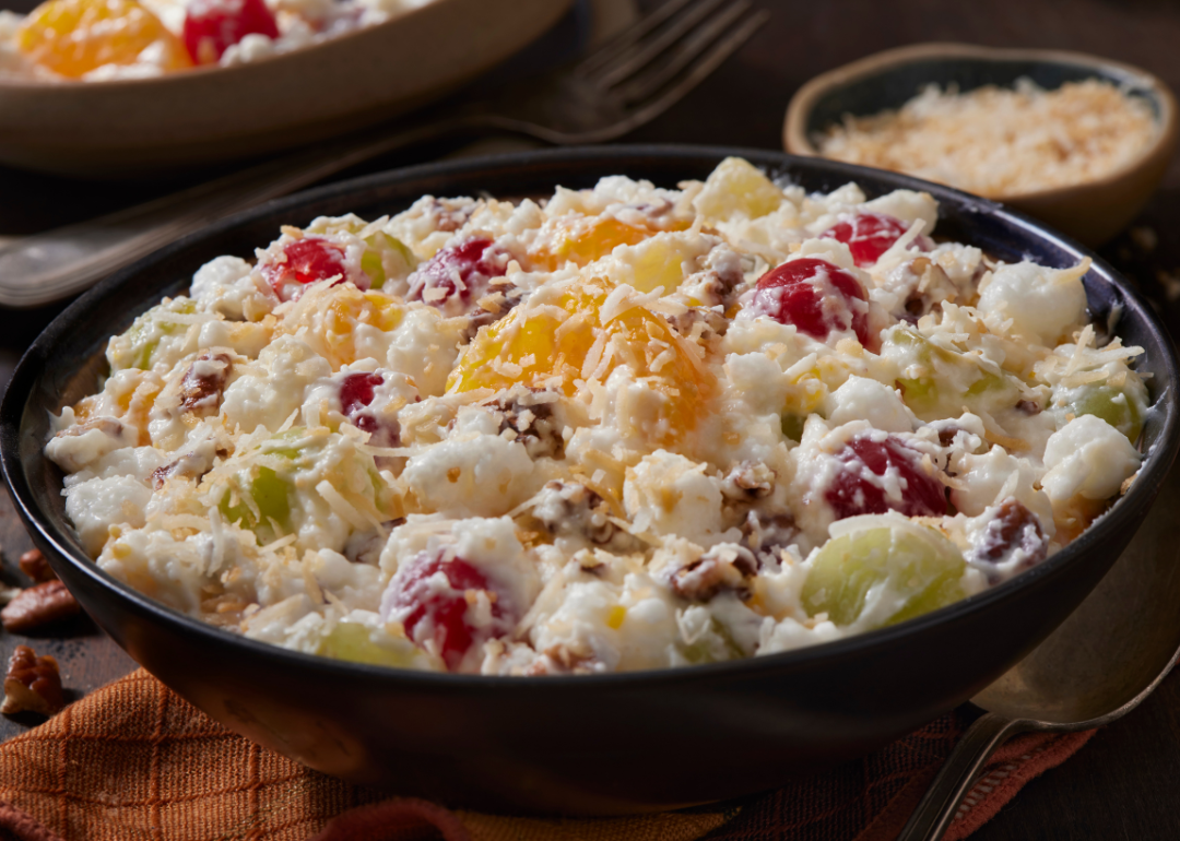 <p>Ambrosia salad is popular in the South, particularly around the holidays. The dish typically includes a variety of canned fruits, marshmallows, coconut, and creamy ingredients like mayonnaise, whipped cream, sour cream, or yogurt. The <a href="https://nationalpost.com/life/food/why-ambrosia-salad-is-the-forgotten-holiday-dish-that-deserves-our-attention">earliest reference</a> to this sweet salad is in the 1867 "Dixie Cookery" cookbook by Maria Massey Barringer.</p>