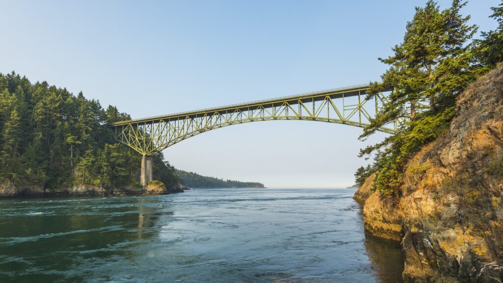 <p>Next up on the list is Deception Pass State Park, just north of Seattle, Washington. This 4,000-acre park encompasses the pass that separates Fidalgo and Whidbey Islands. The crown jewel of the park is the Deception Pass bridge, which stands 180 feet above the swirling waters below. During tide changes, a massive amount of water is funneled through this narrow pass, and sea mammals like sea lions and even orcas can often be spotted frolicking in this natural playground.</p>