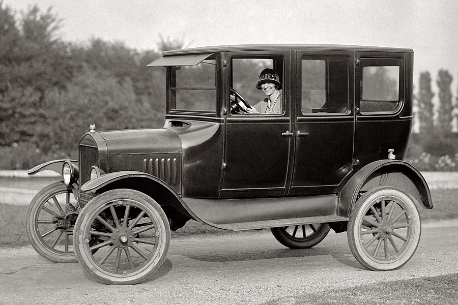 <p>At launch, the Ford Model T was not a saloon in the traditional sense of the term. It was available with two rows of seats but the front compartment was often open and without doors. <strong>1915</strong> brought a closed body with two rows of seats and a centre-mounted door on each side. Ford shifted the T closer to the modern definition of a saloon when for <strong>1923</strong> when it launched a four-door model suitably called <strong>Fordor</strong>.</p><p>Ford made <strong>about 10,666 examples</strong> of the Model T in 1909 , a number that pales in comparison to the <strong>15 million examples</strong> built during the car’s nearly 20-year long production run. Production began increasingly significantly in <strong>1913</strong> when Ford introduced the assembly line system. The system made the Model T more affordable, too. In 1922, annual Model T production totalled <strong>1.3 million examples</strong> and Ford charged <strong>$319</strong> (roughly $5000/£3600 in today's money) for an entry-level model.</p>