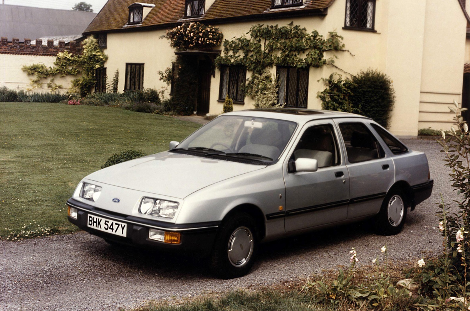 <p>Like the Granada, the Sierra was a one-size-fits-all solution to replacing overlapping models made by Ford’s British and German divisions. It stood out from the <strong>Taunus</strong> and the <strong>Cortina</strong>, its predecessors, with an aerodynamic design that left no one indifferent. Some loved it, and others hated it; few ignored it.</p><p>Ford built the Sierra for over a decade in <strong>more than half a dozen countries</strong>. The range included two- and four-door liftbacks, a four-door saloon, an estate, and even a pickup called <strong>P100</strong>. Rear- and four-wheel-drive variants were offered, and a range-topping model tuned by <strong>Cosworth</strong> arrived in 1988. In hindsight, the Sierra managed to represent all facets of Ford during the 1980s, and helped the company to dominate the UK car market, where its market share hovered consistently around the <strong>30% </strong>mark.</p>