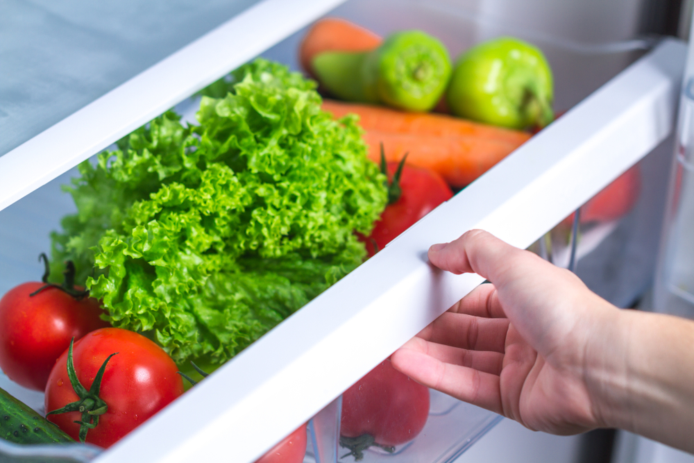 <p>Using a compartment in your refrigerator designed to store lettuce as a hiding place is both clever and unconventional. It's an unexpected location that offers a cool, clean environment, making it perfect for storing small items discreetly. This method benefits from the natural camouflage of being just another drawer in your fridge.</p>