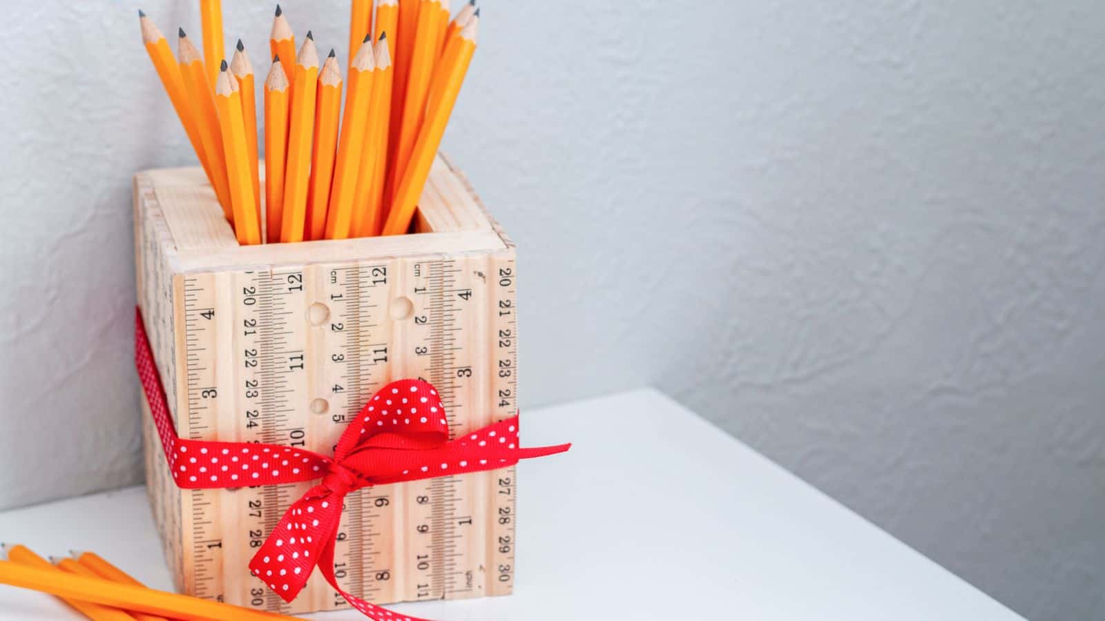 <p>This fun wood craft for kids is the perfect teacher gift. 15″ of scrap wood and a bunch of rulers is all you need to make a ruler pencil holder. Make the box with basic tools and add the rulers using wood glue. Your kids will love this easy wood project and be proud to give it to their teacher. <a href="https://www.anikasdiylife.com/ruler-pencil-holder/">Step-by-step tutorial here.</a></p>