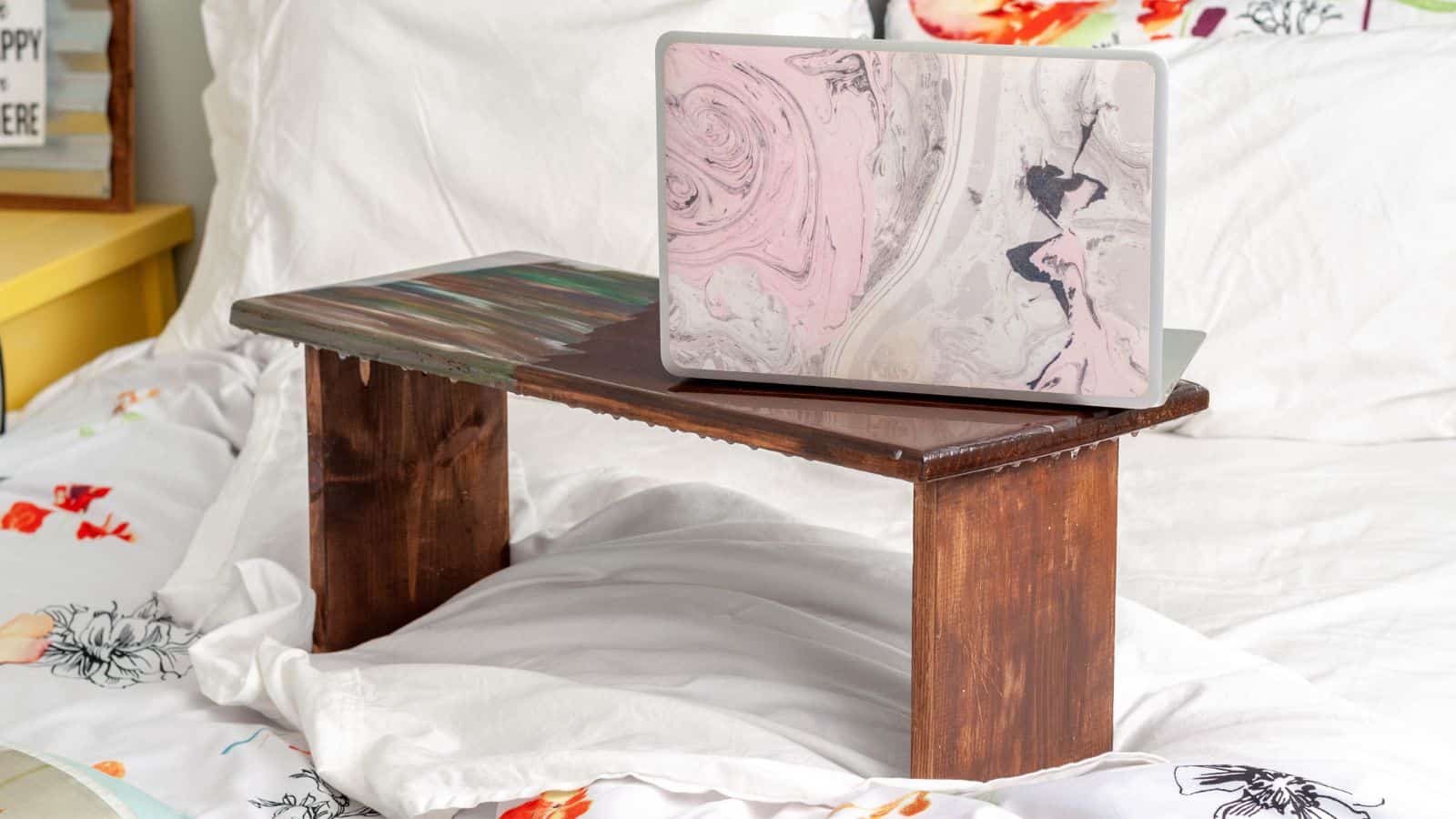 <p>This lap desk is a simple build using basic tools, but the magic happens with the finish on top. The faux epoxy top uses unicorn spit, a gel stain, and a glaze coat that comes in striking colors. Let your child express their creativity when finishing their lap desk. <a href="https://www.anikasdiylife.com/diy-lap-desk-epoxy-resin/">Plans and tutorial here.</a></p>