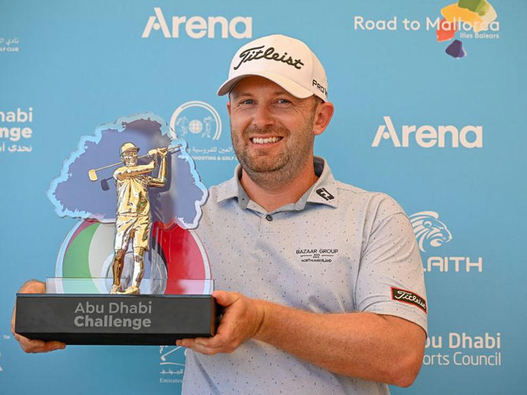 Garrick Porteous celebrates with the trophy in Al Ain