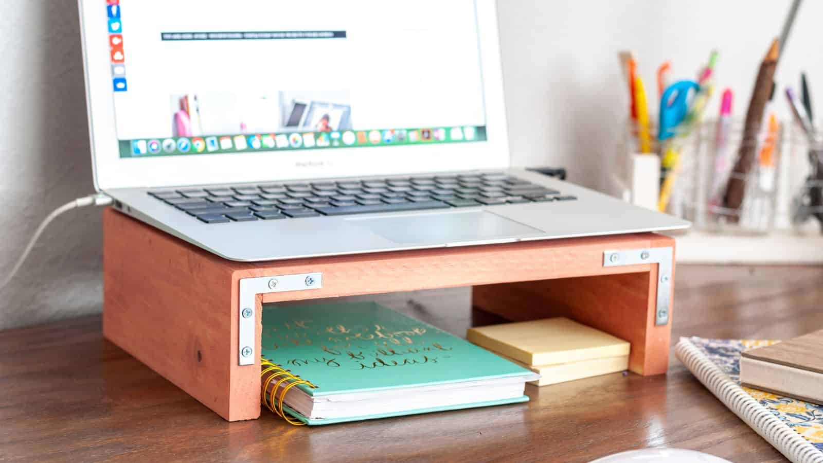 <p>This is the perfect beginner project for kids to make. It uses simple tools and scrap wood. All they need to do is cut the boards and attach them using nails. They will be proud to do homework using a laptop stand they made themselves. <a href="https://www.anikasdiylife.com/diy-laptop-stand-for-desk/">Plans to make it here.</a></p>
