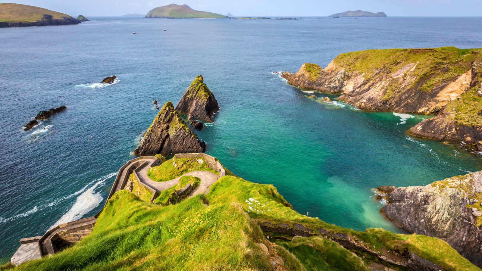 <p>Located on the southwest Atlantic coast, the Dingle Peninsula lives up to its reputation as one of Ireland’s most stunning destinations. It’s raw, rugged, and windswept, with jagged cliffs, verdant hillsides, sandy beaches, and turbulent waters.</p><p>Slea Head Drive on the Wild Atlantic Way is the route that takes you around the Dingle Peninsula. It’s a twisting, turning, and breath-taking loop that starts and finishes in Dingle Town. It’s undoubtedly one of the best things to do in Ireland.</p>
