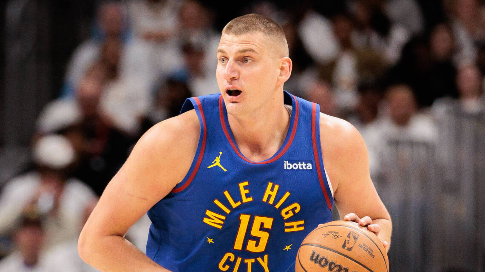 Denver Nuggets center Nikola Jokic (15) drives to the basket during the first quarter against the Los Angeles Lakers in game one of the first round for the 2024 NBA playoffs at Ball Arena.