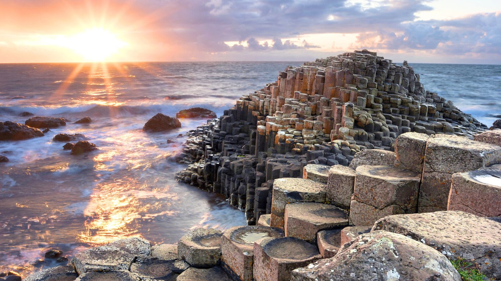 <p>An iconic location comprised of 40,000 interlocking columns, Giant’s Causeway is one of the most popular attractions in Northern Ireland.</p><p>The location of this UNESCO World Heritage site is epic, too. Massive cliffs provide an atmospheric backdrop, and the stormy North Atlantic Ocean stretches to the horizon. Wild and windy walks blessed with dramatic coastal views are the order of the day here.</p>