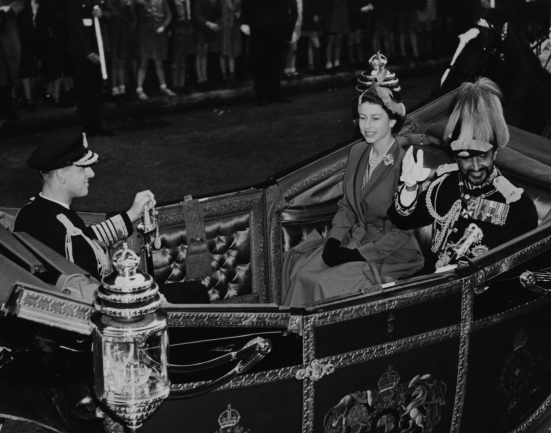 Emperor Haile Selassie of Ethiopia waves to the crowds as he rides in an open carriage with Queen Elizabeth II and <a href="https://uk.starsinsider.com/celebrity/256255/the-life-and-times-of-hrh-prince-philip-duke-of-edinburgh" rel="noopener">Prince Philip</a>.<p><a href="https://www.msn.com/en-nz/community/channel/vid-7xx8mnucu55yw63we9va2gwr7uihbxwc68fxqp25x6tg4ftibpra?cvid=94631541bc0f4f89bfd59158d696ad7e">Follow us and access great exclusive content every day</a></p>