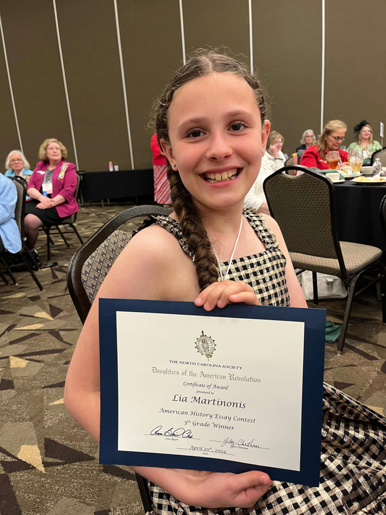 Bruce Drysdale Elementary School's Lia Martinonis was honored April 20 in Durham for winning first place in the state in the Daughters of the American Revolution essay contest. She also won the Southeastern Division and has advanced to the national competition.