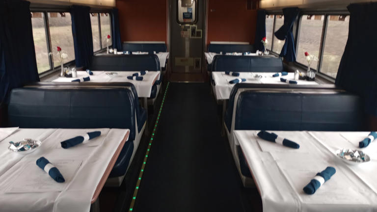 The dining car is ready for mealtime.