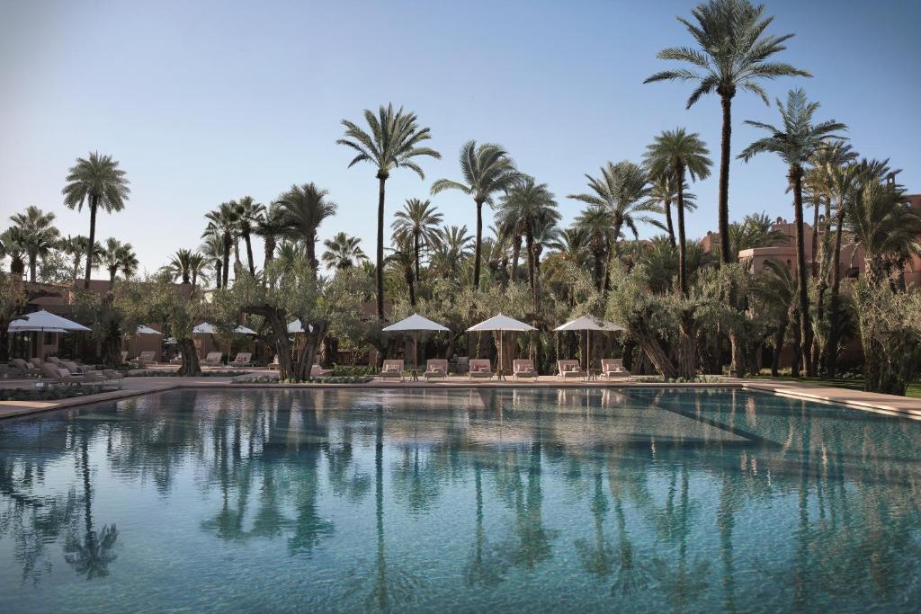 <p>Located in the heart of the Moroccan desert<strong>, <a href="https://www.booking.com/hotel/ma/royal-mansour-marrakech.en.html?aid=1689668&no_rooms=1&group_adults=2">Marrakech Royal Mansour is a lavish oasis</a></strong> that offers a unique blend of traditional Moroccan architecture and modern amenities. Each suite is beautifully decorated with intricate details and has a private pool, Jacuzzi, and a stunning view of the desert. Guests can also enjoy various activities, such as camel rides, hot air balloon rides, and traditional Moroccan spa treatments.</p>