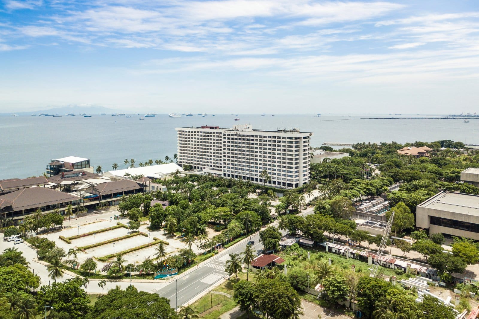 <p class="wp-caption-text">Image Credit: Shutterstock / MDV Edwards</p>  <p><span>Sofitel Philippine Plaza Manila is a five-star luxury hotel in Pasay City, Manila’s cultural and entertainment complex. The hotel is situated near Manila Bay and offers panoramic views of the bay and its famous sunsets, providing a tranquil escape within the bustling metropolis. Designed by National Artists Leandro Locsin and Ildefonso P. Santos, the hotel seamlessly blends French elegance with Filipino craftsmanship, making it a distinguished landmark in the city.</span></p> <p><span>The hotel features 609 rooms and suites, each elegantly furnished and equipped with modern amenities to ensure a comfortable and luxurious stay. The accommodations cater to business and leisure travelers, offering spacious layouts, high-speed internet access, and sophisticated in-room technology.</span></p>