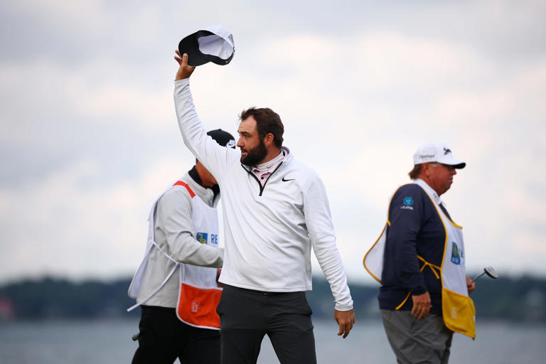 Scottie Scheffler tips his cap after winning the RBC Heritage at Harbour Town Golf Links in Hilton Head Island, South Carolina.