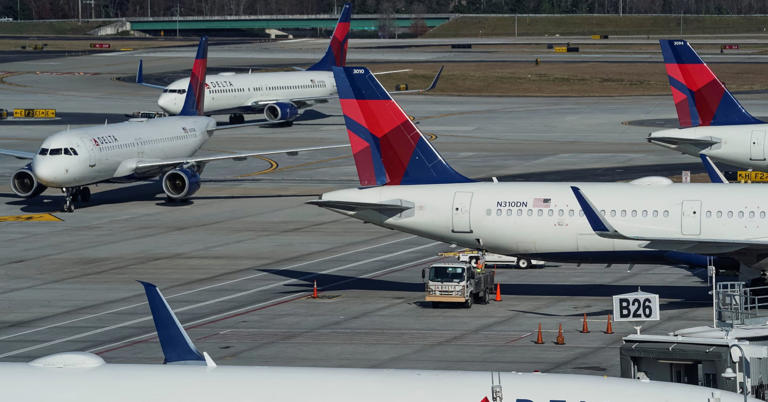 Delta Air Lines jets are seen on a taxiway at Hartsfield-Jackson Atlanta International Airport in Atlanta on Dec. 22, 2021.