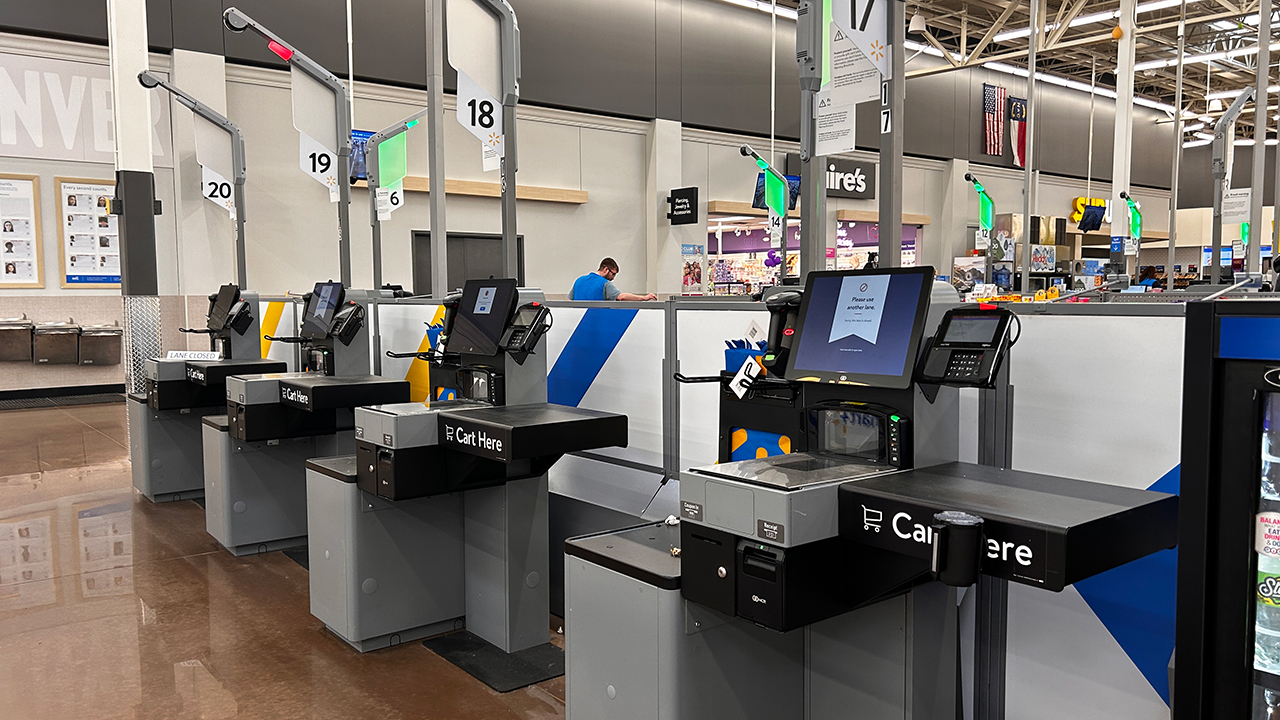 two walmart stores remove self-checkout machines as retail giants re-think the self-service option