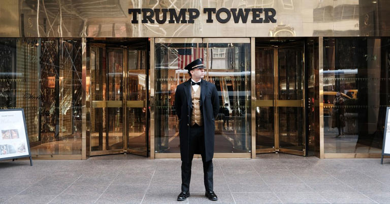 A doorman who has not accused any former presidents of tawdry behavior stands outside Trump Tower. Spencer Platt/Getty Images