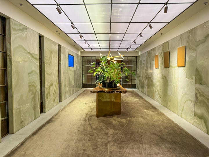 <p>Onyx stone covered the wall in the main hallway, and there was ample seating space wherever I ventured. </p><p>The furnishings throughout the space were upscale and the lounge felt like a <a href="https://www.businessinsider.com/best-hotel-hong-kong-luxury-business-mandarin-oriental-photos-2018-7">luxury hotel</a>. At times, I didn't even feel like I was in an airport.</p>