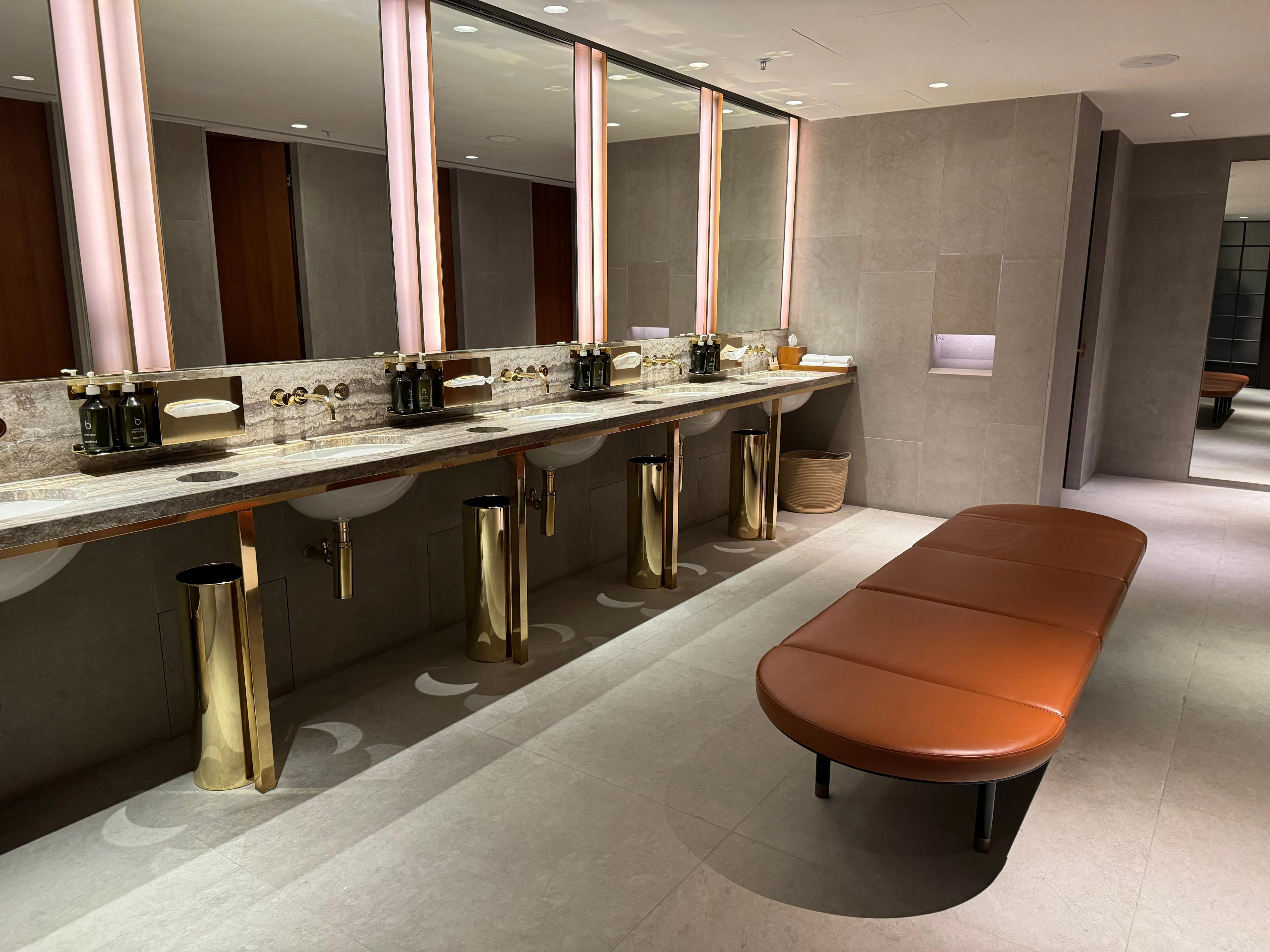 <p>Bathrooms featured luxury bath amenities, well-lit mirrors, and spacious stalls.</p>