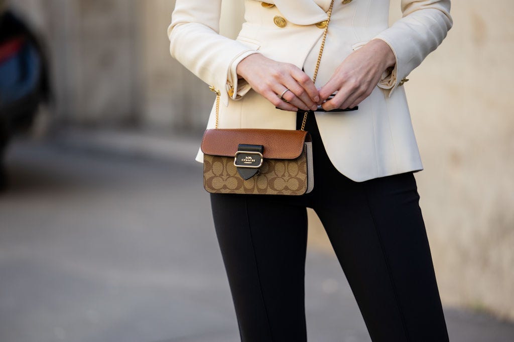 microsoft, the handbag wars have begun after the us sued to block the merger of coach and michael kors