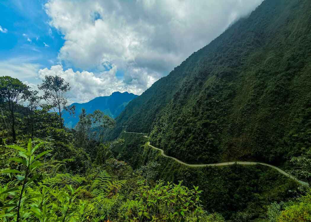 <p>Nicknamed the “Road of Death”, this 80-km highway connecting Coroico and La Paz is not for the faint-hearted. This astonishingly winding and narrow road is only about 3.5 meters wide and doesn’t have barriers to keep cars from falling nearly 4,600 meters down to the Amazon valley below.</p><p>Fog, rain, and dust clouds reduce visibility along the North Yungas Road to almost 0%, while mudslides are also common. Over the years, about 200 to 300 hundred people would die annually on the North Yungas Road. But thankfully, these numbers have progressively decreased in recent years thanks to the installation of guardrails, paving, and extended width in some areas.</p>