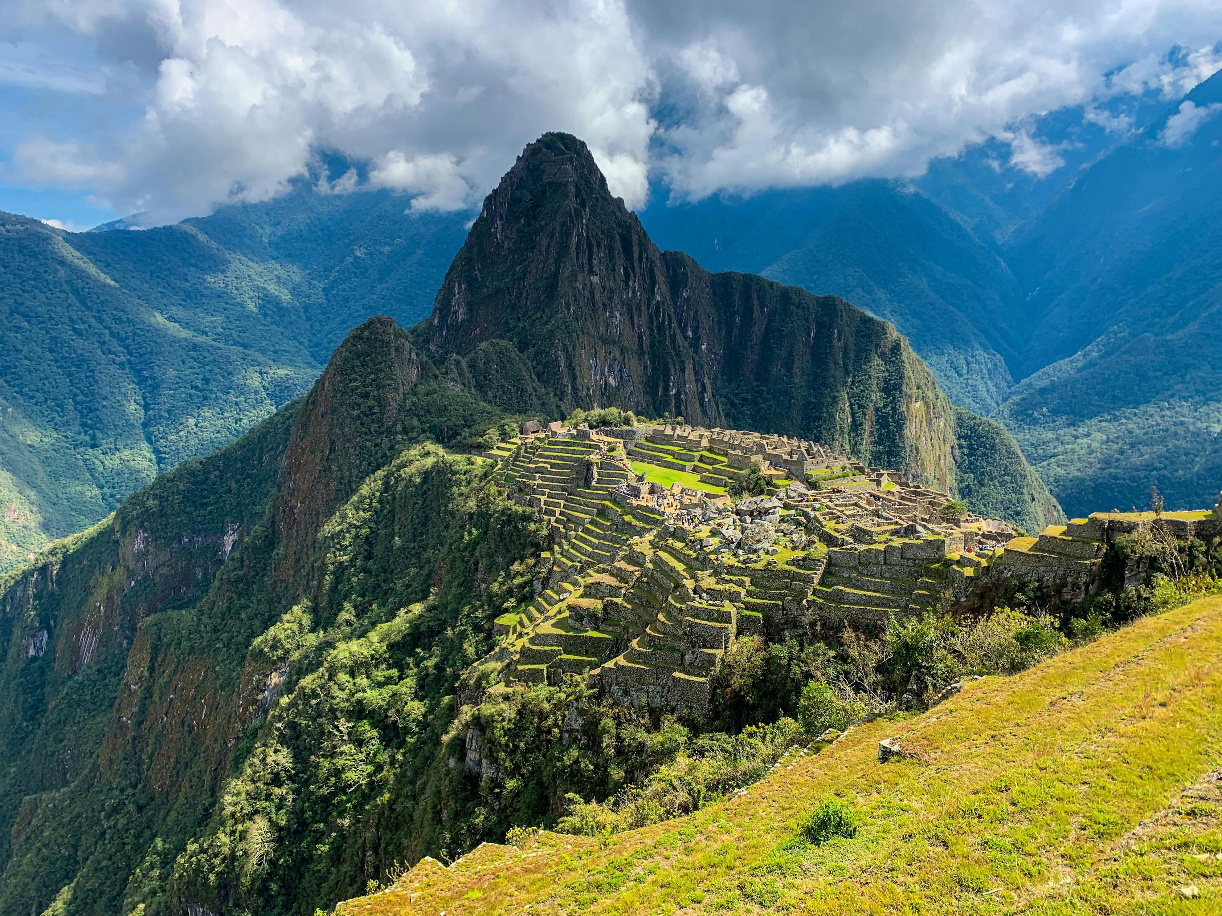 <h3>Machu Picchu, Peru</h3><p>Machu Picchu is one of the seven modern wonders of the world, and something you have to see to truly believe. To get there, fly into Lima and spend a few days in the coastal city. From there, take a domestic flight (1-2 hours) to Cuzco and begin making your way to the mountains. Getting around the small mountain towns of Peru is no joke, so I recommend joining a guided tour for ease. Stay overnight in a traditional hacienda to continue taking in the beauty of your surroundings, and consider extending your trip to visit the Rainbow Mountains.</p>