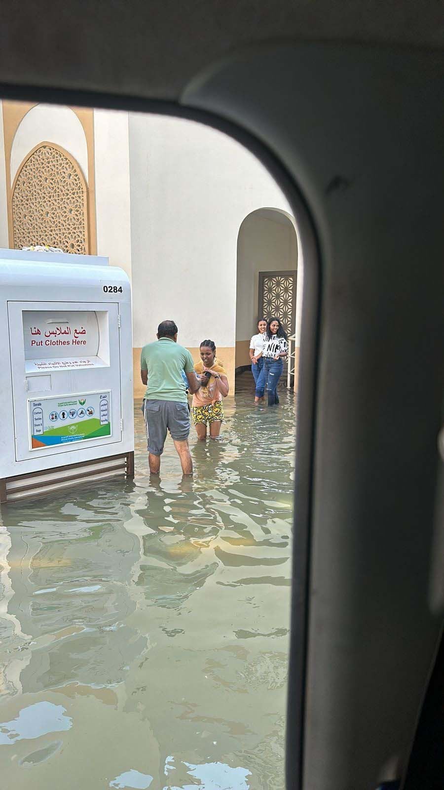 volunteers use dinghys to float supplies to sharjah residents almost a week after floods