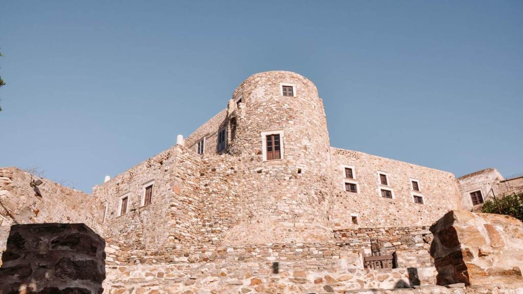 <p>Built in the 13th century, this Venetian Castle is one of the most popular things to do on the Greek island of Naxos. Since it is the highest point, you can enjoy a stunning 360-degree view from here. However, what makes this special are the endless twisting alleyways leading to museums and monasteries that make you ponder its historical significance.</p><p>While it is only a short walk there, people often get confused with the directions, so be sure to ask someone for help.</p><p class="has-text-align-center has-medium-font-size">Read also: <a href="https://worldwildschooling.com/landmarks-in-greece/">Well-Known Greek Landmarks</a></p>