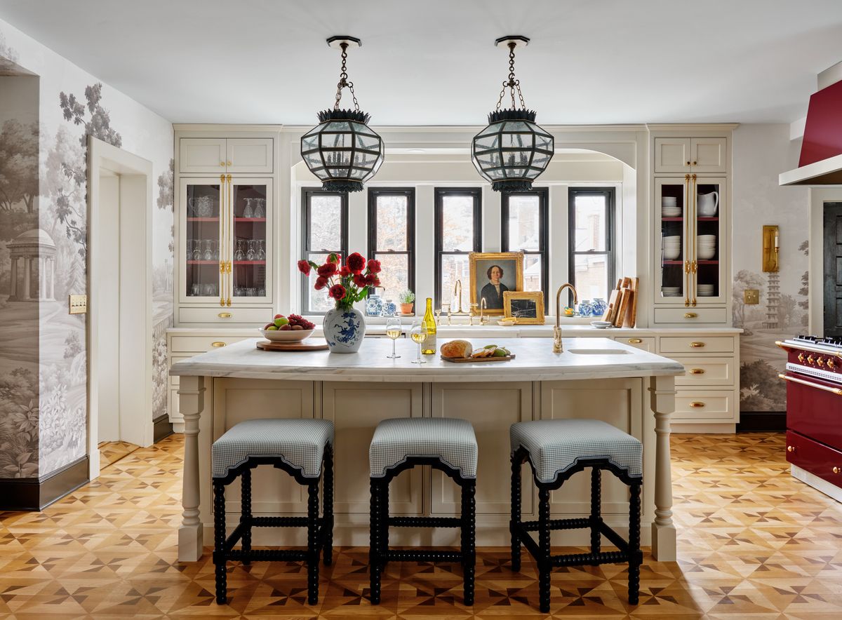 <p>In Hartford, Connecticut, interior <a href="https://www.mccoryinteriors.com/">designer Kristen McCory</a>'s clients presented her with a rosy proposition: Use a deep burgundy Lacanche range and hood as a starting point and then don't hold back.</p><p>"It was a chance to do something completely different," says McCory, who repeated the rich shade inside the glass cabinets flanking the sink (and on floor-to-ceiling cabinetry in an adjacent butler's pantry). But like all satisfying spice, the beauty is in the balance. Pegasus marble countertops, linen white cabinetry paint, and black accents temper the red.</p>