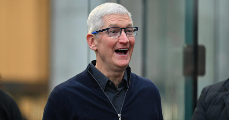 Apple CEO Tim Cook greets customers as he arrives for the release of the Vision Pro headset at the Apple Store in New York City on Feb. 2, 2024.